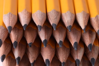 Photo of Many graphite pencils as background, closeup view