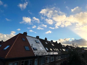 Photo of Residential building with roof renovation under blue sky