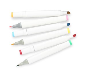 Photo of Many double-sided marker pens on white background, top view