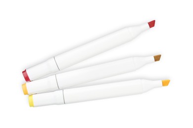 Photo of Double-sided marker pens on white background, top view