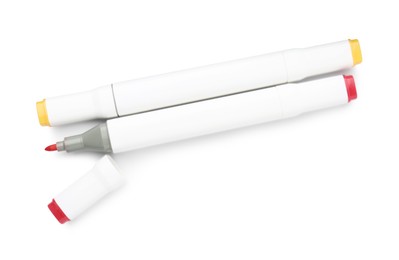 Photo of Double-sided marker pens on white background, top view