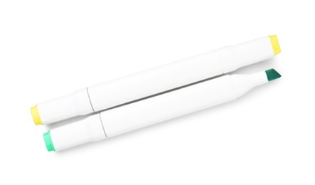 Photo of Double-sided marker pens on white background, top view