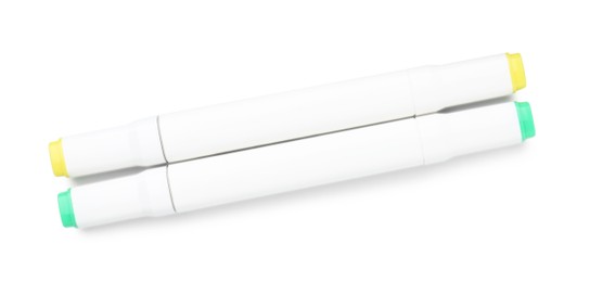 Photo of Double-sided marker pens on white background, top view