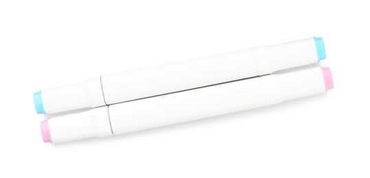 Photo of Double-sided marker pens on white background, top view