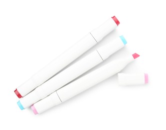 Photo of Double-sided marker pens on white background, top view