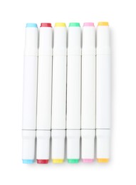 Photo of Double-sided marker pens on white background, top view