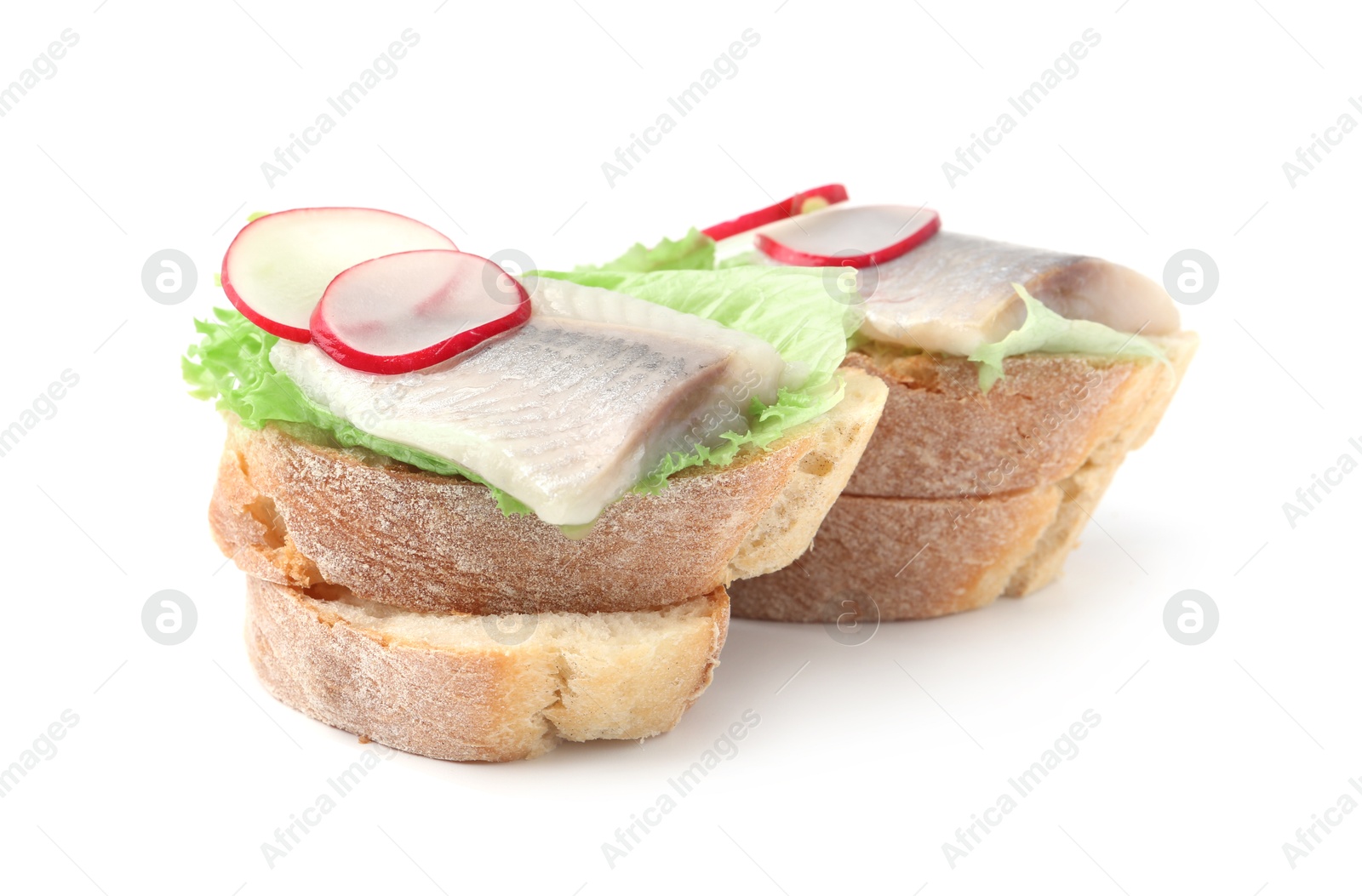 Photo of Tasty sandwiches with herring, radish and lettuce on white background