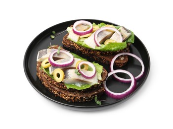 Photo of Tasty sandwiches with herring, onions, lettuce and olives isolated on white