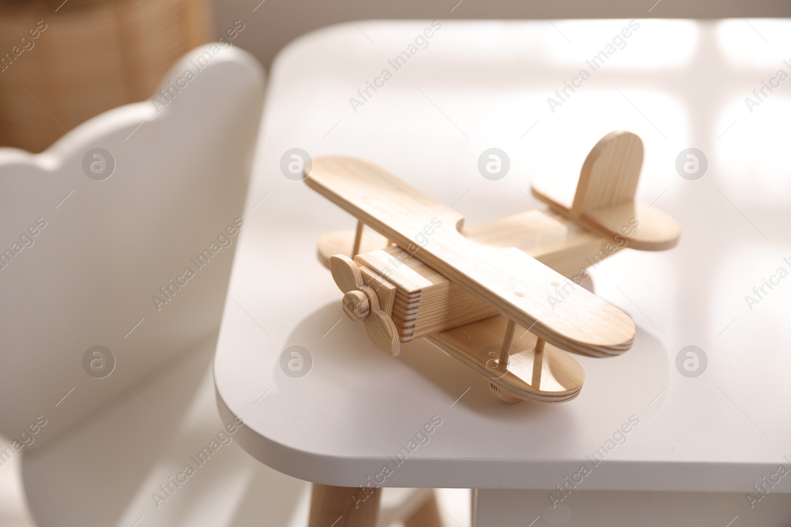 Photo of Toy plane on table in child's room, closeup