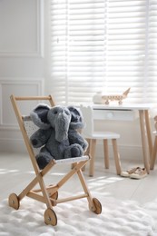 Photo of Different toys and stylish furniture in child's room