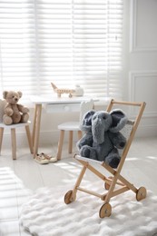 Photo of Different toys and stylish furniture in child's room