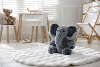 Photo of Different toys and stylish furniture in child's room