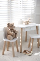 Different toys and stylish furniture in child's room