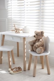 Different toys and stylish furniture in child's room