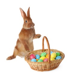 Image of Cute fluffy rabbit and colorful Easter eggs isolated on white