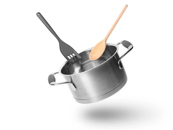 Image of Saucepan, wooden spoon and slotted spatula in air on white background