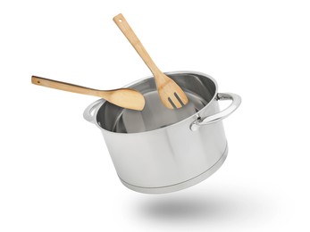 Image of Saucepan, wooden spoon and turner in air on white background