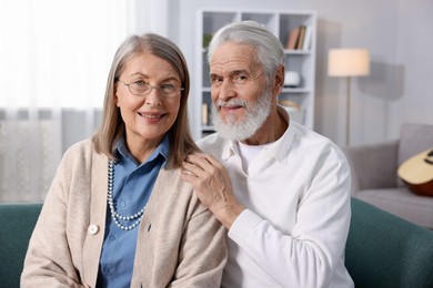 Photo of Portrait of happy elderly couple at home