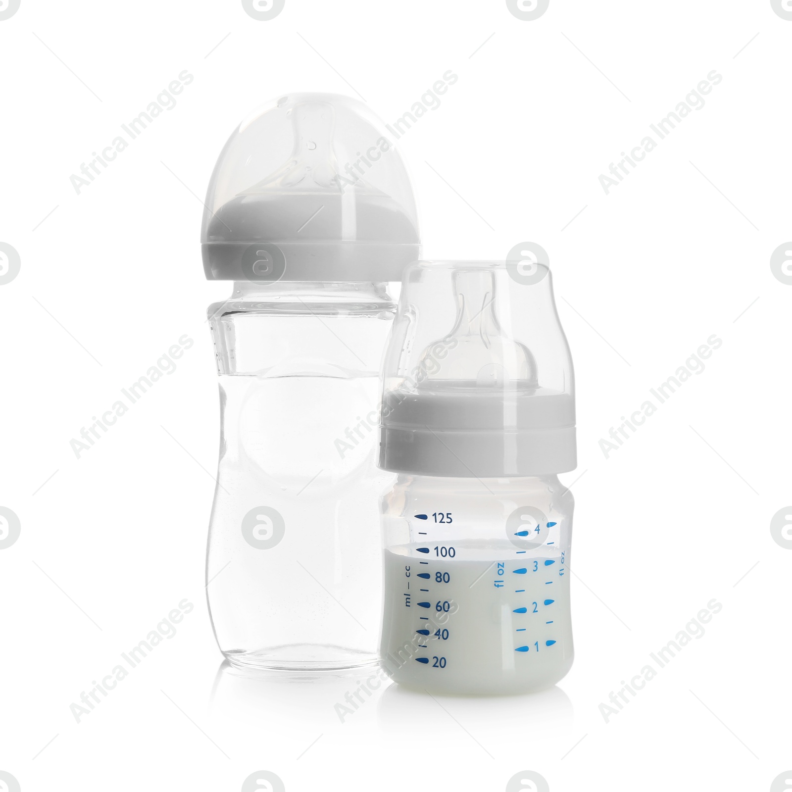 Photo of Feeding bottles with milk and water isolated on white