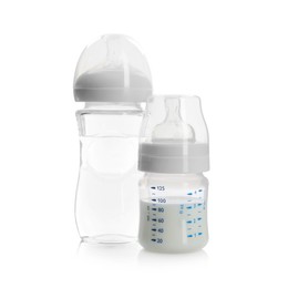 Photo of Feeding bottles with milk and water isolated on white