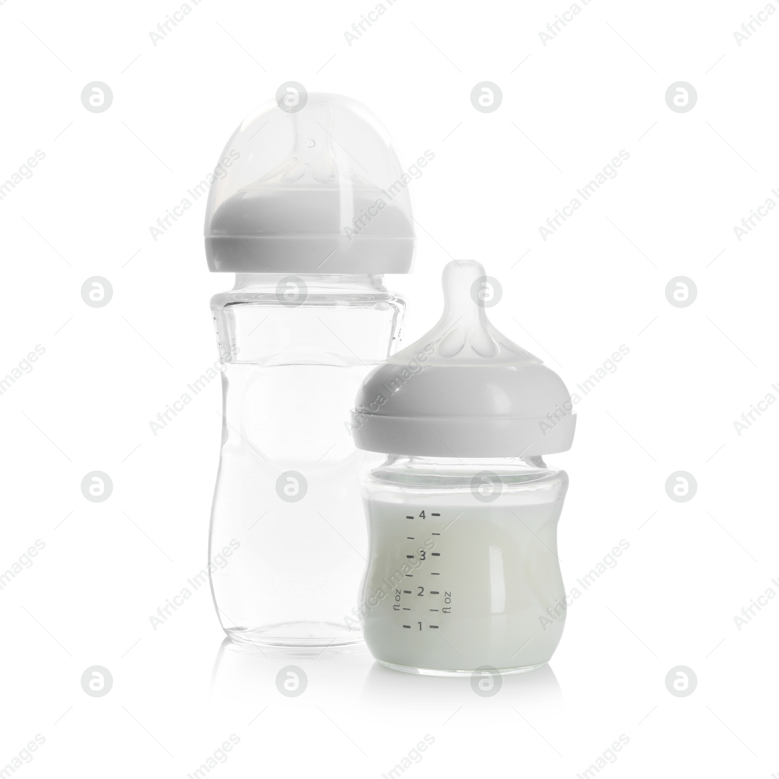 Photo of Feeding bottles with milk and water isolated on white