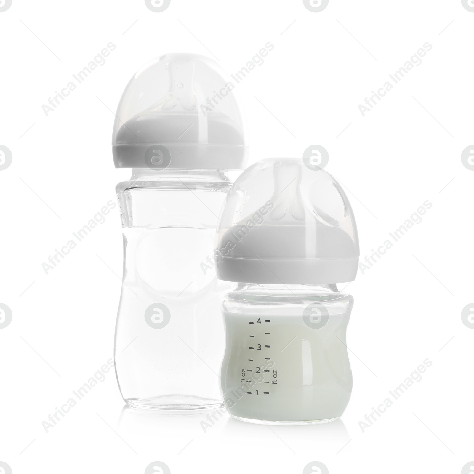 Photo of Feeding bottles with milk and water isolated on white