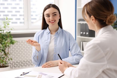 Contraception. Woman having appointment with gynecologist in clinic