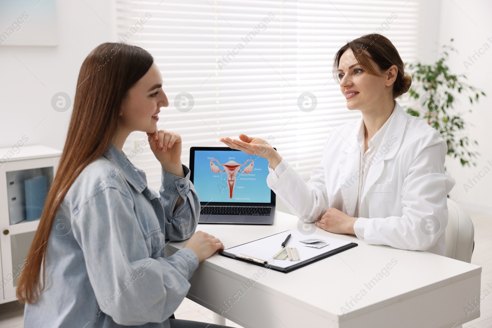 Photo of Contraception. Woman having appointment with gynecologist in clinic