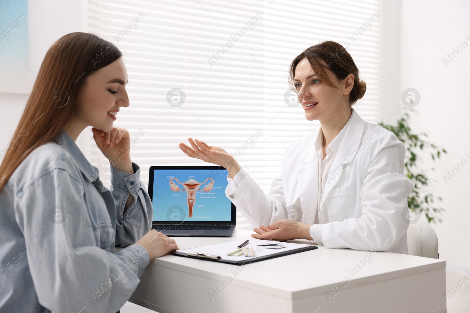 Photo of Contraception. Woman having appointment with gynecologist in clinic