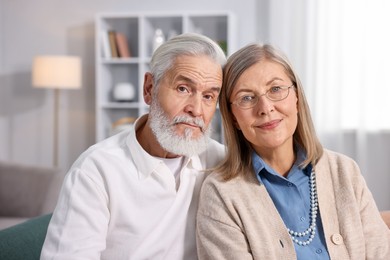 Photo of Portrait of cute elderly couple at home