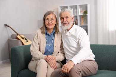 Photo of Cute elderly couple on sofa at home