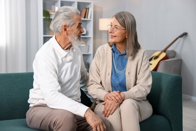 Photo of Cute elderly couple on sofa at home