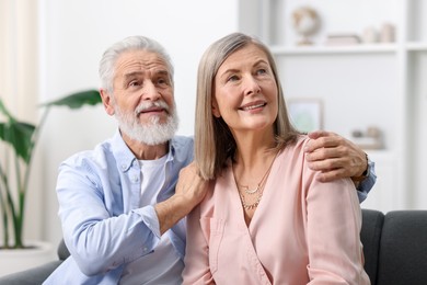 Photo of Portrait of happy elderly couple at home