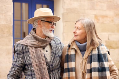 Photo of Lovely elderly couple together on city street