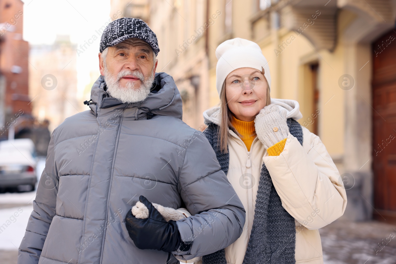 Photo of Lovely elderly couple together on city street