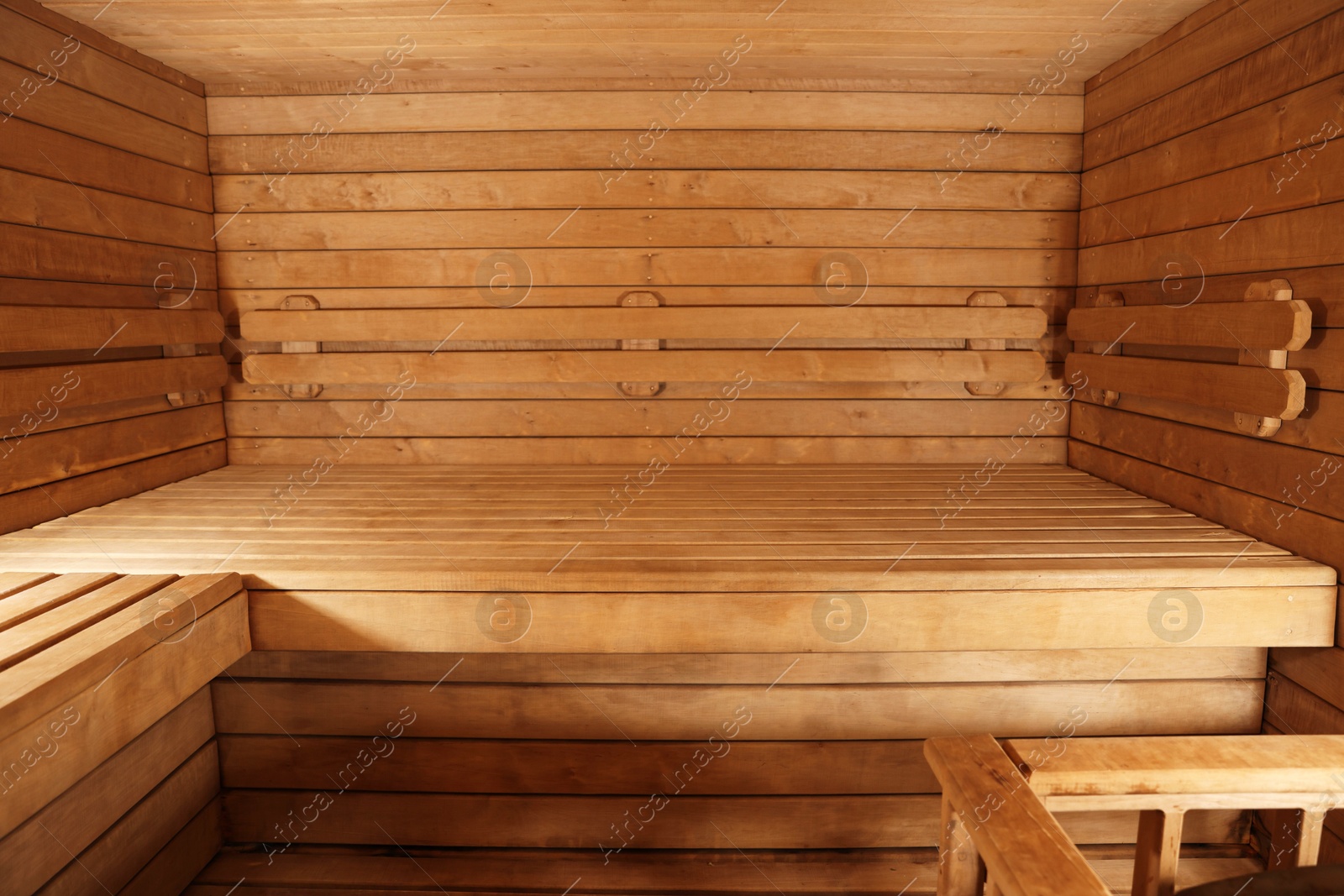 Photo of Empty wooden sauna with bench. Luxury relax