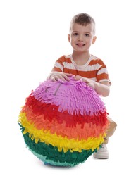 Happy boy with colorful pinata on white background