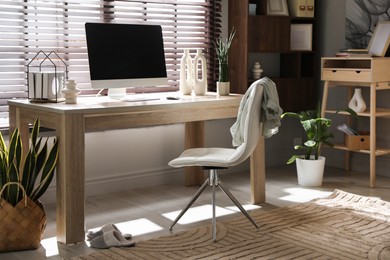 Comfortable workplace with computer in home office