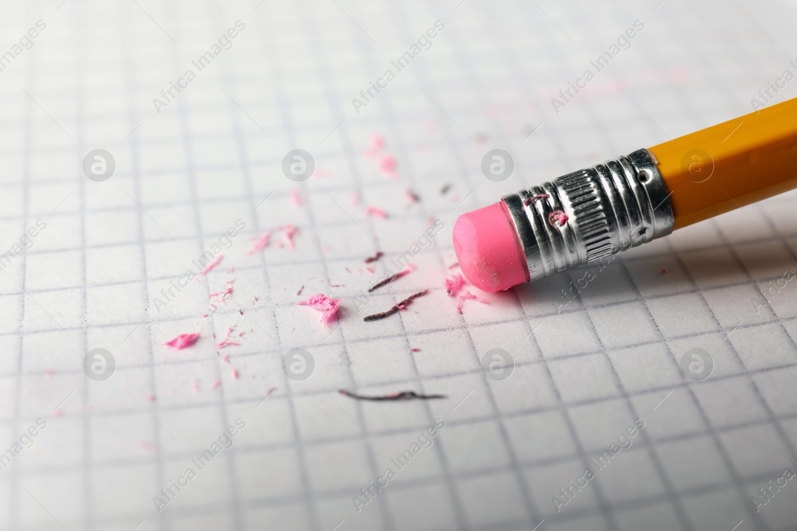 Using pencil with eraser on white sheet of paper, closeup Photo of Using pencil with eraser on white sheet of paper, closeup