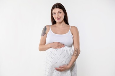 Beautiful pregnant woman with cute belly on white background