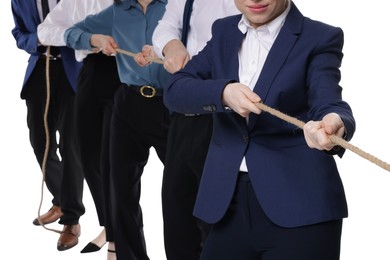 Photo of Competition concept. Businesspeople pulling rope on white background, closeup