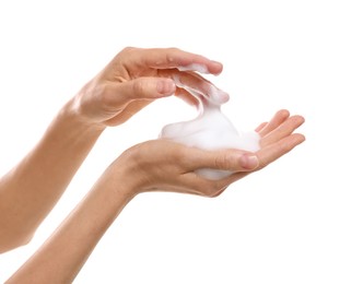 Photo of Woman washing hands with foaming soap on white background, closeup. Hygiene