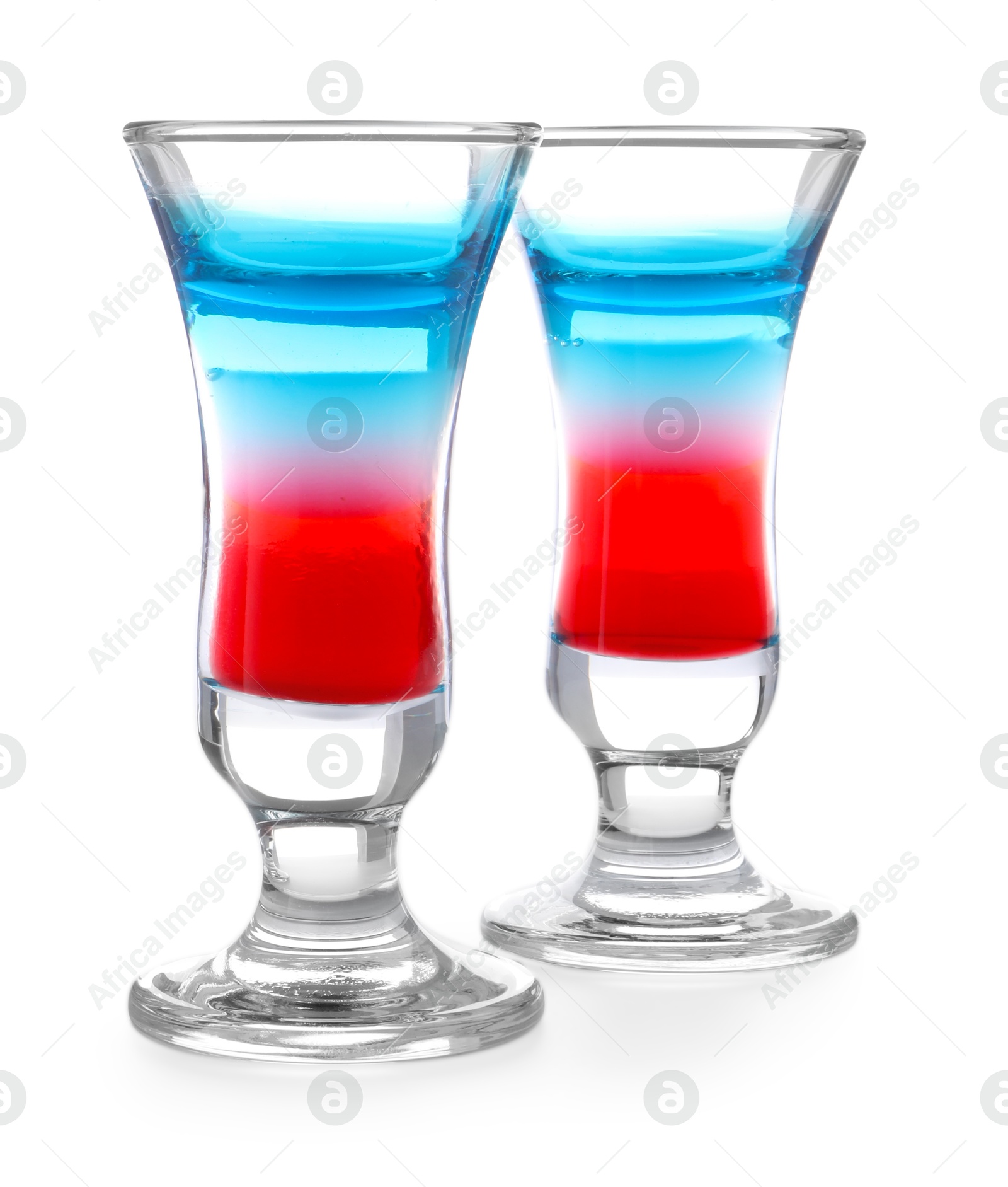 Layered cocktails in colors of American flag isolated on white Photo of Layered cocktails in colors of American flag isolated on white
