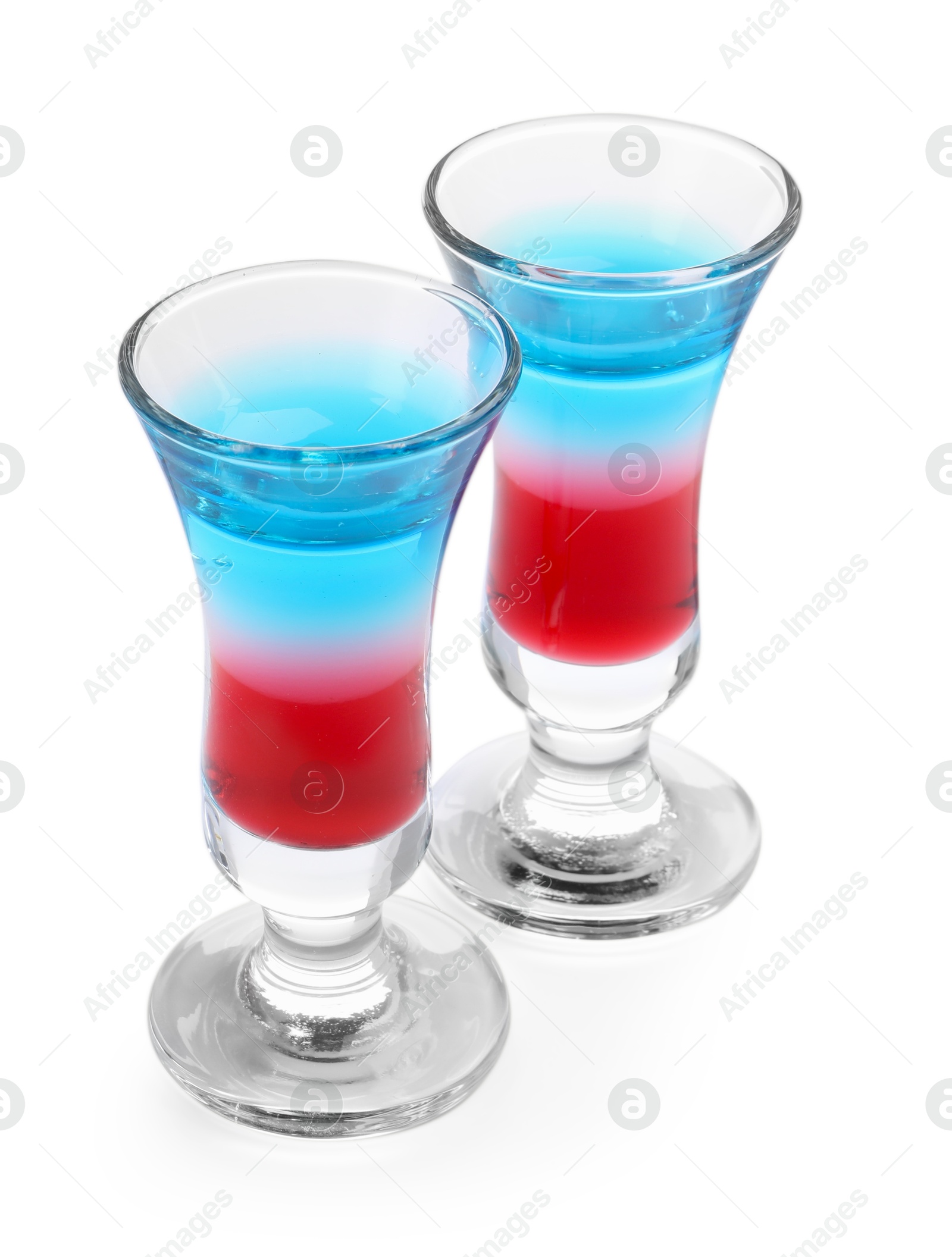 Layered cocktails in colors of American flag isolated on white Photo of Layered cocktails in colors of American flag isolated on white