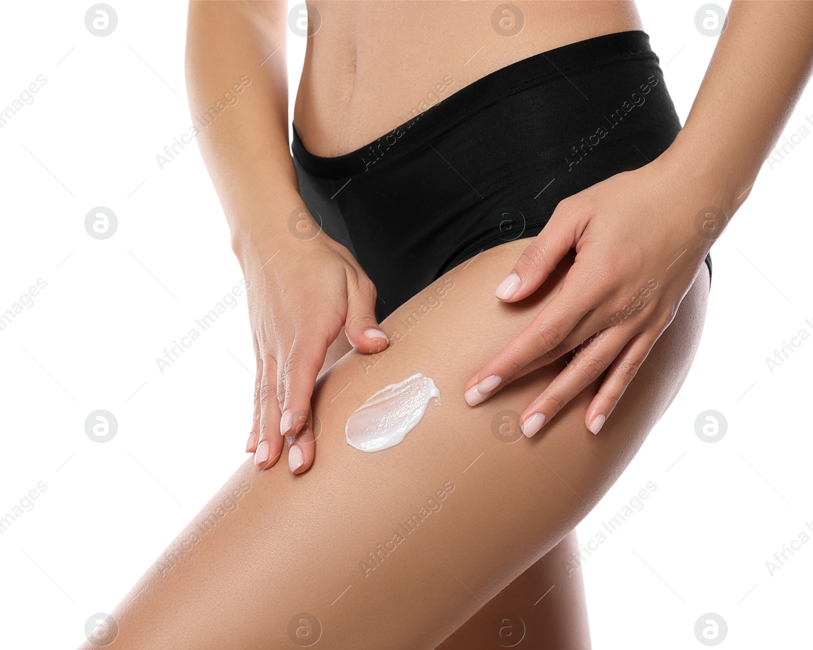 Photo of Woman applying anti cellulite cream on white background, closeup