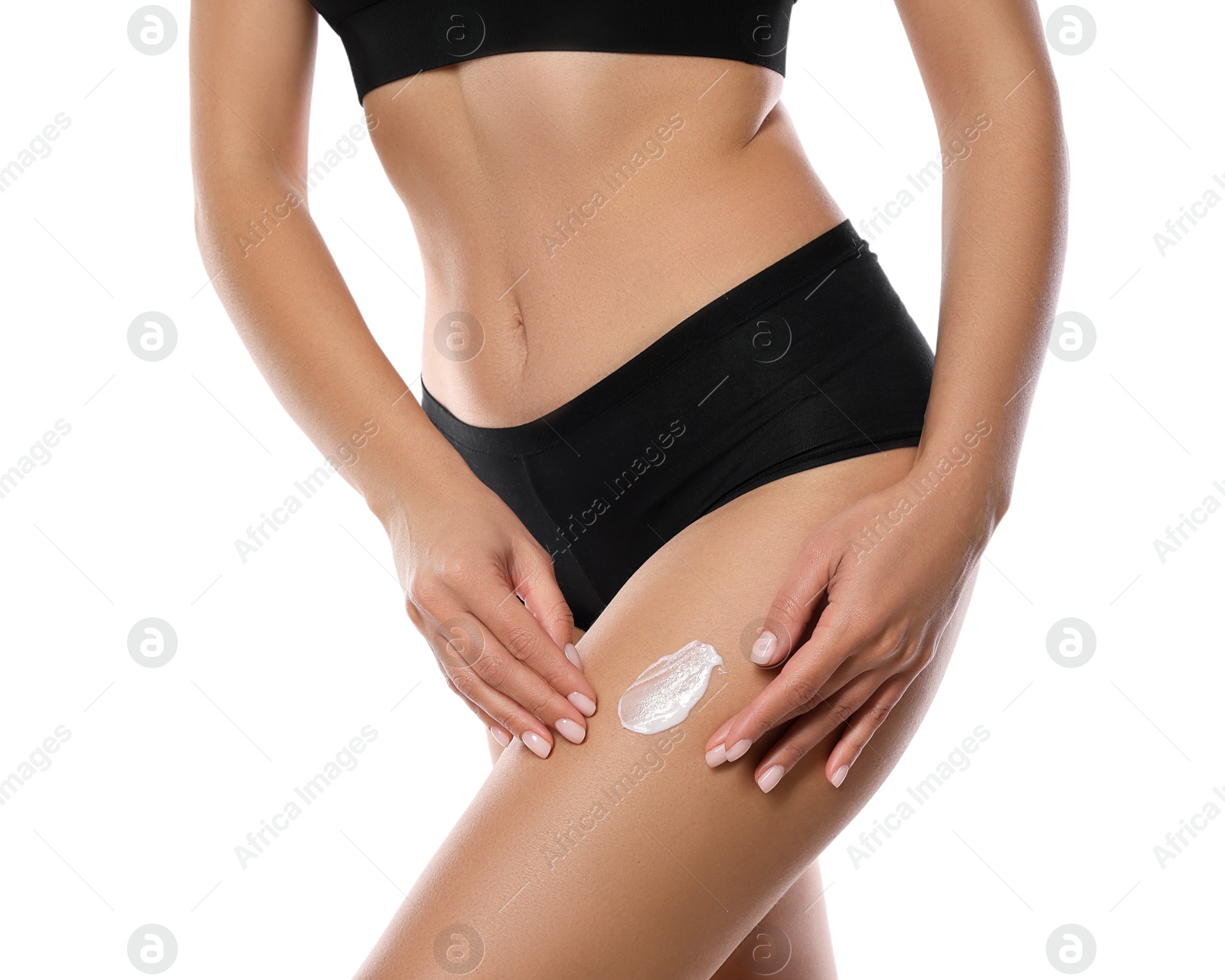 Photo of Woman applying anti cellulite cream on white background, closeup