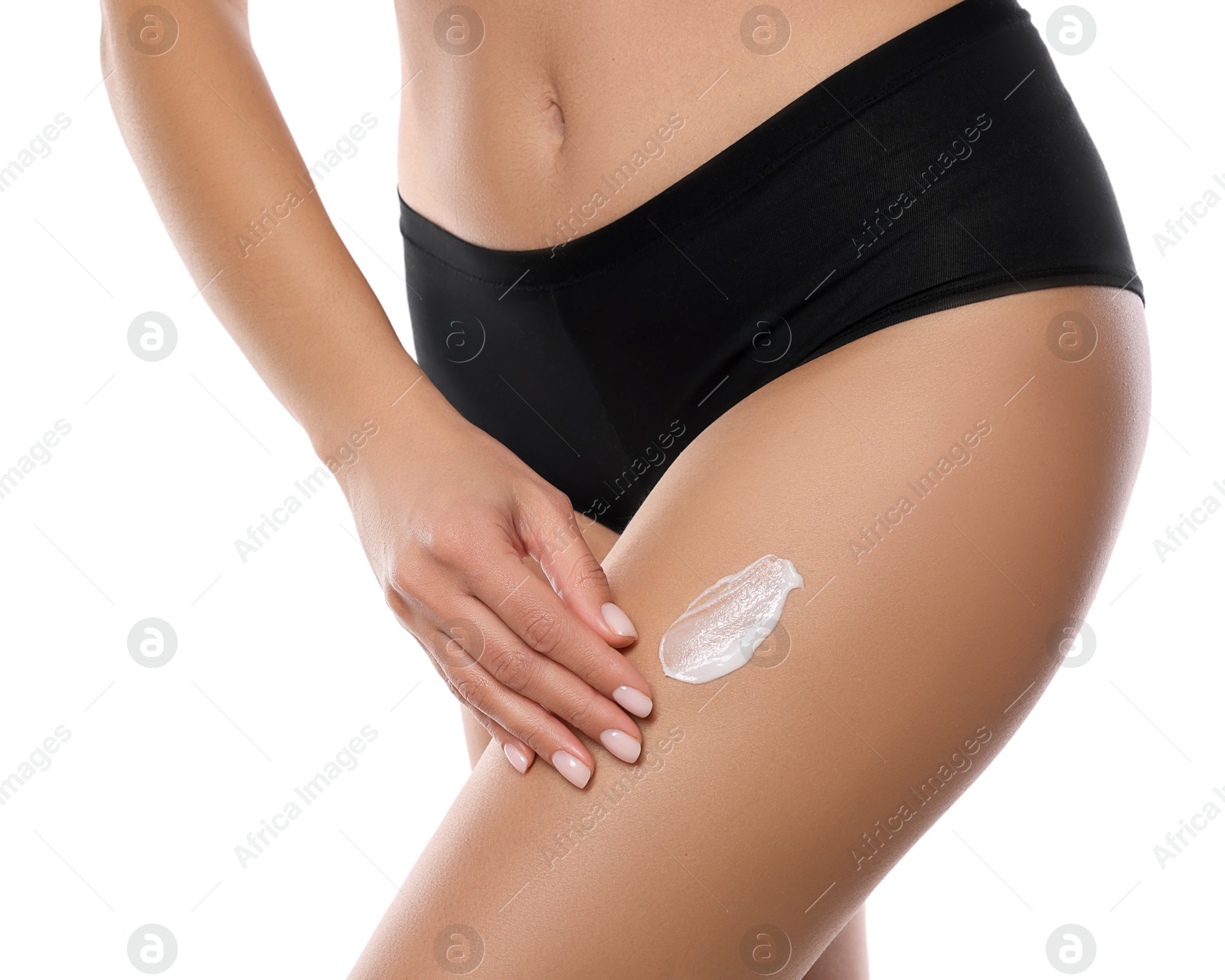 Photo of Woman applying anti cellulite cream on white background, closeup