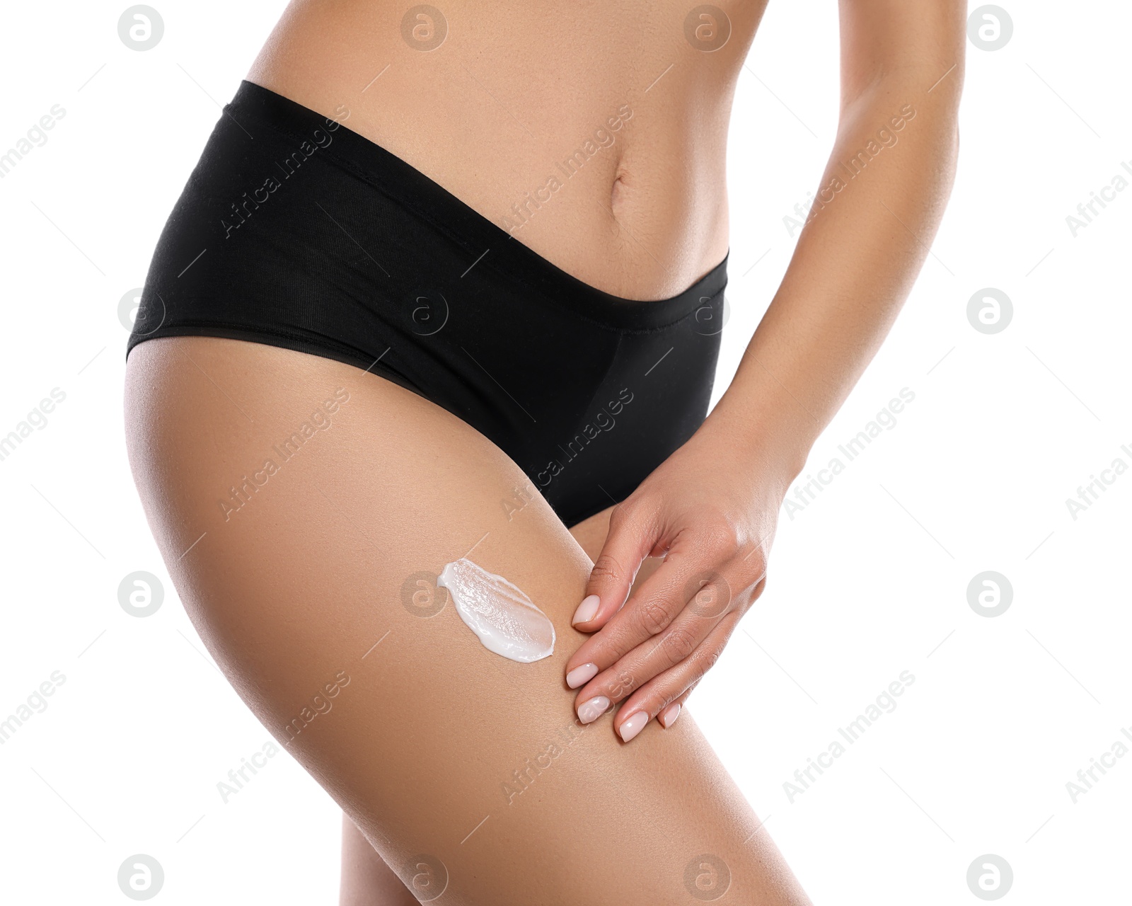 Photo of Woman applying anti cellulite cream on white background, closeup