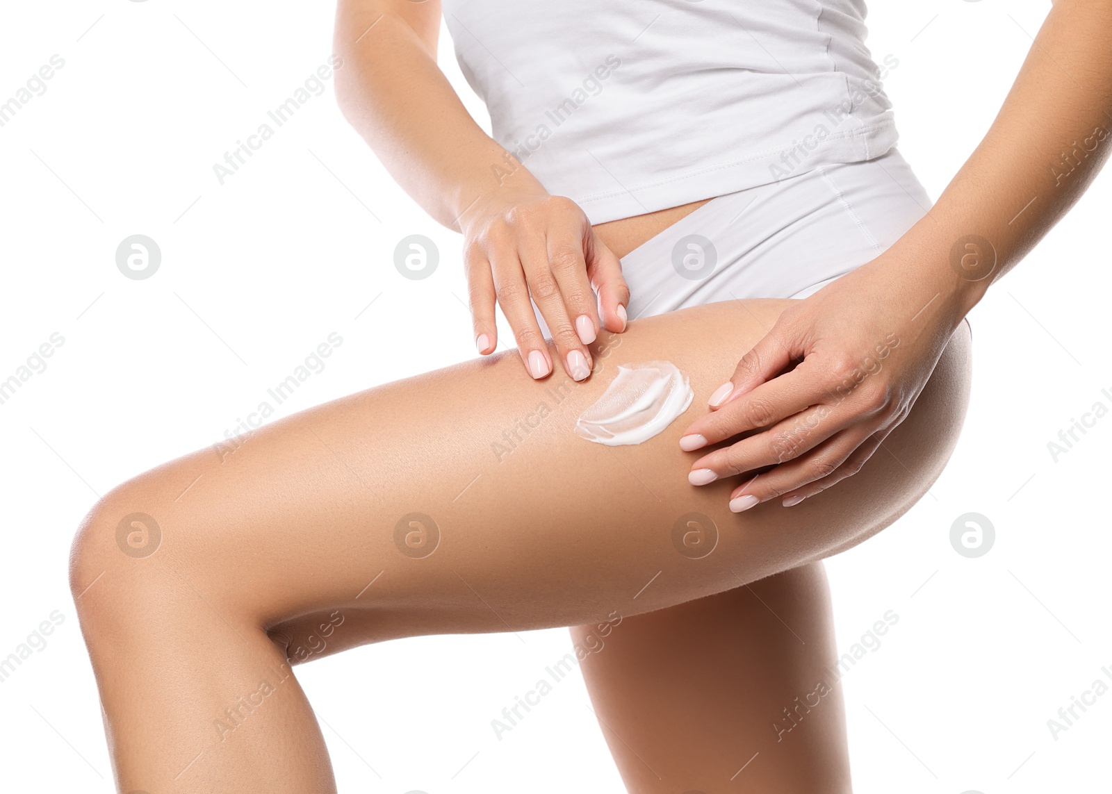 Photo of Woman applying anti cellulite cream on white background, closeup