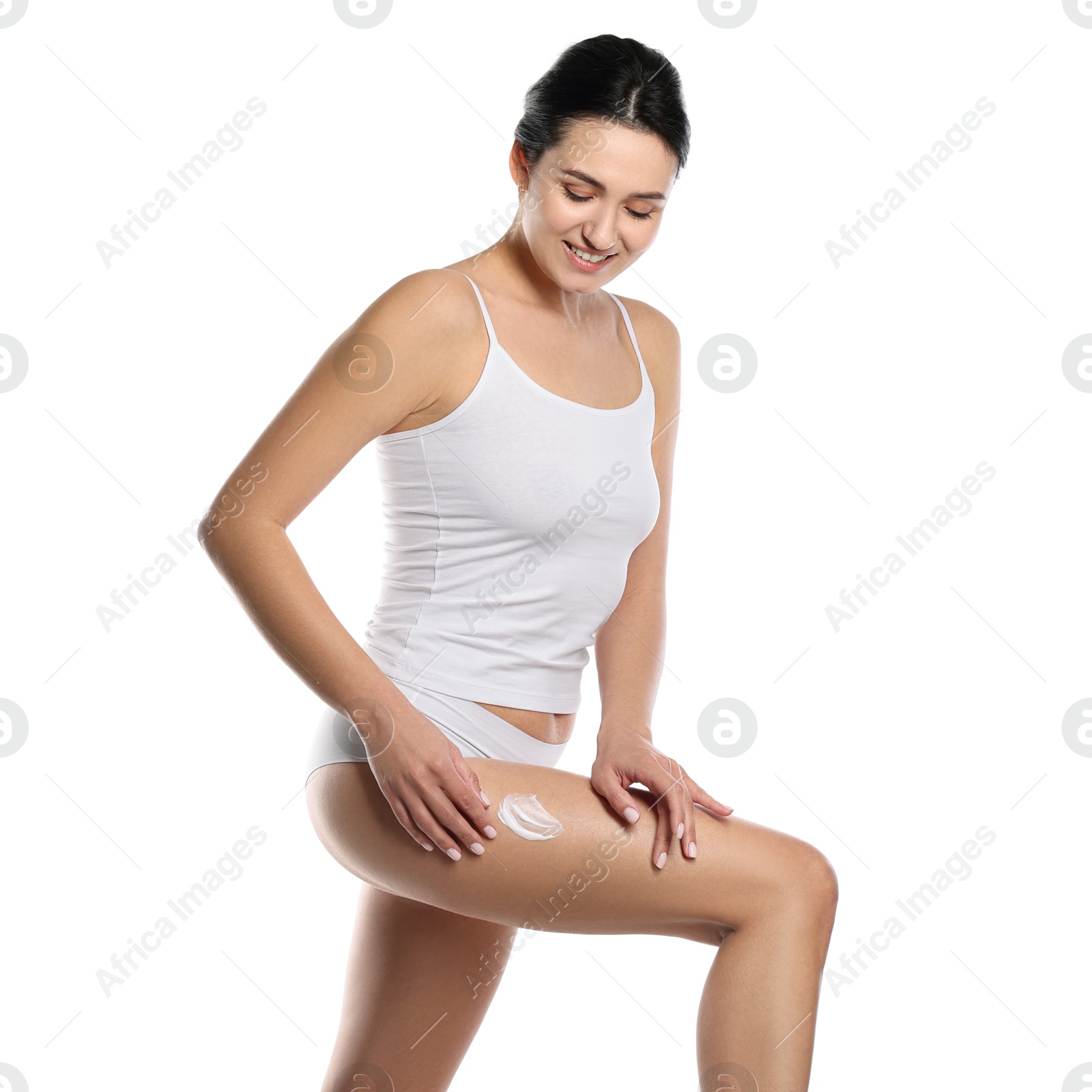 Photo of Woman applying anti cellulite cream on white background